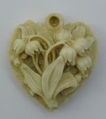 A Victorian carved ivory pendant