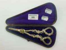 A boxed pair of silver grape scissors