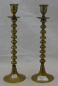 A pair of brass candlesticks