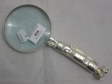 A magnifying glass,