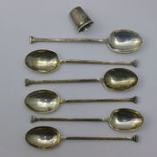 A set of six silver coffee spoons and a thimble