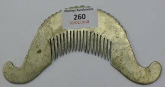 A Chinese white metal comb