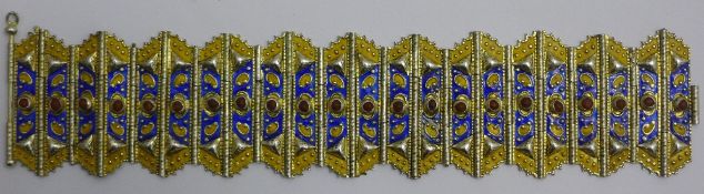 An enamelled gilt metal hinged cuff bangle