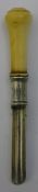 A 19th century unmarked silver and ivory apple corer