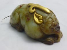 A Chinese gilt heightened jade mythical beast