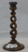 An early 20th century brass mounted barley twist candlestick