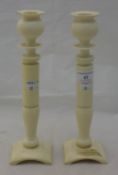 A pair of Victorian ivory candlesticks