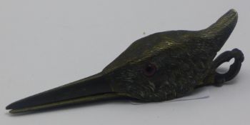 A bronze letter clip in the form of a bird