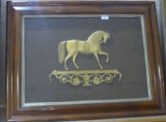 A 19th century framed gilt metal applique of the horse Black Eagle