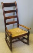 A 19th century rush seated ladder back rocking chair - WITHDRAWN