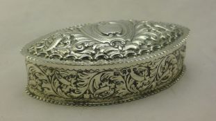 A Victorian embossed silver trinket box