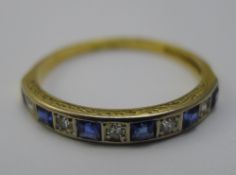 An 18 ct gold diamond and sapphire ring