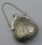 A silver miniature purse