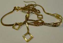 An 18 ct gold bracelet and a pair of Saudi gold earrings (7 grammes all in)