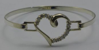 A silver heart bangle