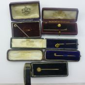 Five various gold stickpins