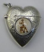 A silver vesta in the form of a heart