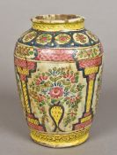 An antique Persian pottery vase Of ovoid form, decorated with floral vignettes. 22 cm high.