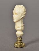 A 19th century carved ivory handled seal Worked as the bust of a gentleman,