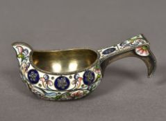 A Russian enamel decorated silver kovsh Of small proportions with trailing foliate decorations,