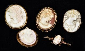 Four various 19th century cameo brooches and a pendant Each depicting the bust of a classical woman.