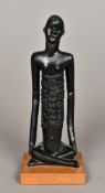 A Sitibi carved wood deity Worked seated cross legged with scarified elongated body. 20 cm high.