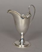 A George III Irish silver cream jug, hallmarked Dublin circa 1780,