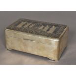 An unmarked Thai silver cigarette box Of hinged rounded rectangular form,