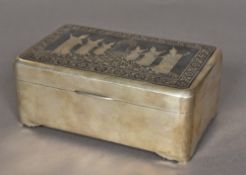 An unmarked Thai silver cigarette box Of hinged rounded rectangular form,