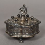 An Indian white metal spice box With hinged compartmentalised lobed body beneath the cast bird