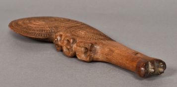 A Maori Wahaika Tiki war club With typical spirally carved decorations,