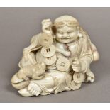 A Chinese carved soapstone figure of Liu Haichan Typically worked. 14 cm high.