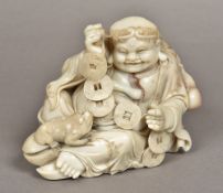 A Chinese carved soapstone figure of Liu Haichan Typically worked. 14 cm high.