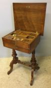 A 19th century Swedish walnut work table The crossbanded moulded hinged rectangular top enclosing