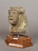 A Pre-Columbian carved stone head (600-900 AD) Mexico On a carved wood plinth base. 22.5 cm high.