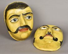 Two large Indian papier mache masks Each modelled as a moustachioed gentleman.