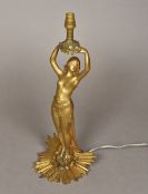 An Art Nouveau gilt bronze figural table lamp Modelled as a semi-nude female figure above a