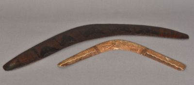 A carved Aboriginal hardwood boomerang Worked with emus; together with another, later,