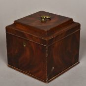 A George III mahogany tea caddy The hinged moulded rectangular top with brass loop handle,