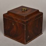 A George III mahogany tea caddy The hinged moulded rectangular top with brass loop handle,