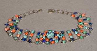 A Chinese silver necklet Set with lapis lazuli, turquoise and coral. 40.5 cm long.