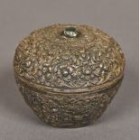 A 19th century Persian silver box and cover With overall embossed scrolling floral decoration,