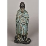 A Chinese painted carved wooden model of an immortal Modelled wearing a headdress and a long