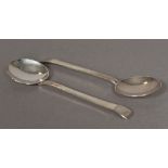 A pair of Scottish Arts & Crafts style planished silver spoons, hallmarked Edinburgh 1942,