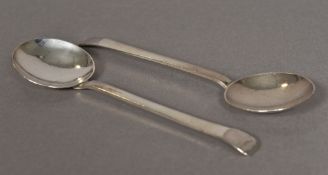 A pair of Scottish Arts & Crafts style planished silver spoons, hallmarked Edinburgh 1942,