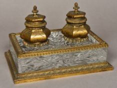 A Victorian gilt bronze mounted cut crystal glass double inkwell The underside stamped Eppay, Paris.