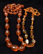 Two amber bead necklaces One facet cut. 96 cm and 69 cm long respectively.