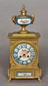 A 19th century Sevres style painted porcelain plaque mounted gilt metal mantle clock Surmounted