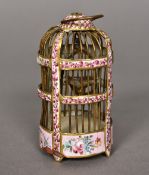 A 19th century enamel decorated miniature bird cage, probably French Worked with floral sprays. 9.