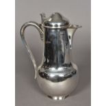 A George V silver lidded jug, hallmarked London 1910,